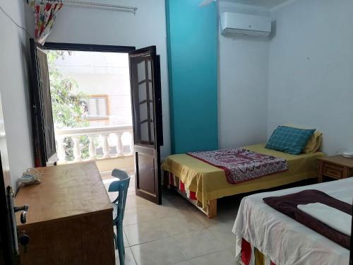 Ένα ή περισσότερα κρεβάτια σε δωμάτιο στο cozy room 2 Hurgada a room in apartment