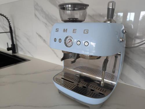 a mixer sitting on top of a counter at Reel Relax Retreat at Dora Creek in Dora Creek