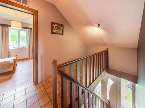 a staircase in a house with a mirror at Charming cottage in heart of the Ardennes in Lierneux