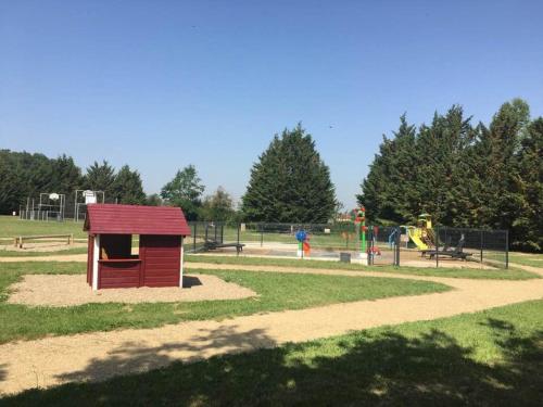 a park with a playground with a smallshed at Gîtes proches vignoble, déco cosy, terrasse, activités familiales et nature - Tout inclus - FR-1-489-235 in Meillard