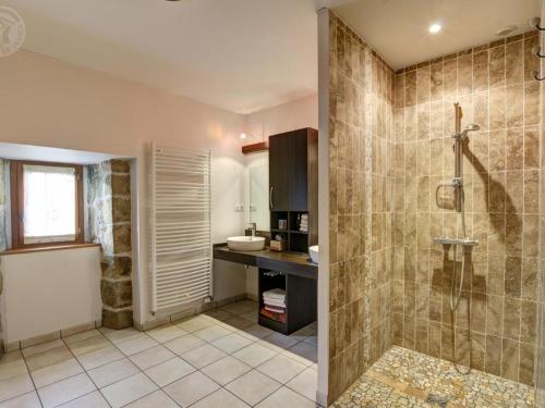 a bathroom with a shower and a sink at Gîte confortable avec jardin, cheminée, et wifi à Montarcher - FR-1-496-11 in Montarcher