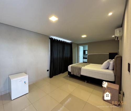 Ένα ή περισσότερα κρεβάτια σε δωμάτιο στο Apartamento com Vista nas alturas e Área de Lazer