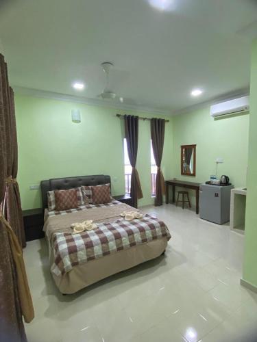 a bedroom with a large bed in a room at BESTUBA COTTAGE at PULAU TUBA, LANGKAWI in Pulau Selang Besar