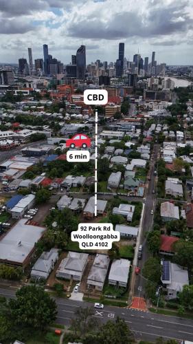 an aerial view of a city with a street sign at CozyHomes Woolloongabba B&B in Brisbane