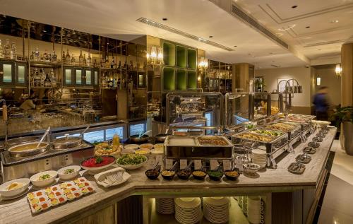 a buffet line with many different types of food at La Siesta Premium Lakeside in Hanoi