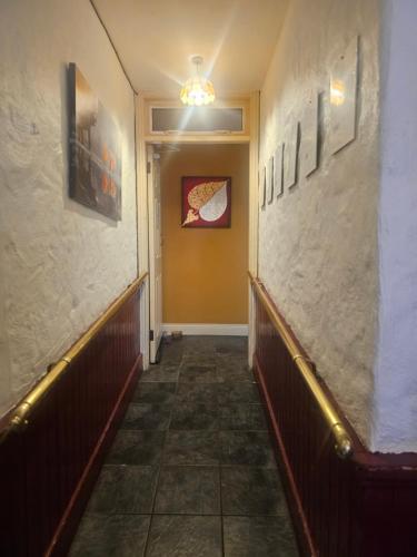 a hallway with benches and pictures on the walls at Listowel Town in Listowel