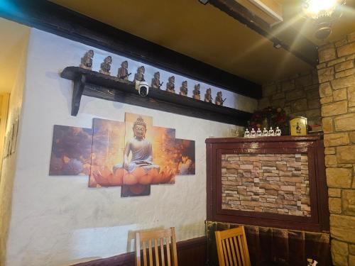 a room with a wall with paintings on it at Listowel Town in Listowel