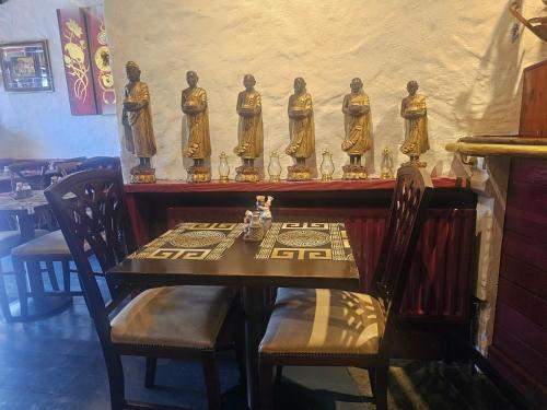 a table with a group of statues on top of it at Listowel Town in Listowel