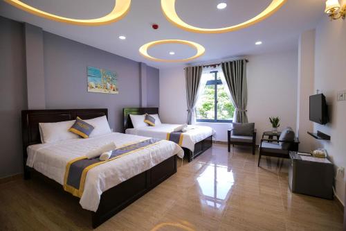 Ένα ή περισσότερα κρεβάτια σε δωμάτιο στο Sea Hotel CD by BAY LUXURY