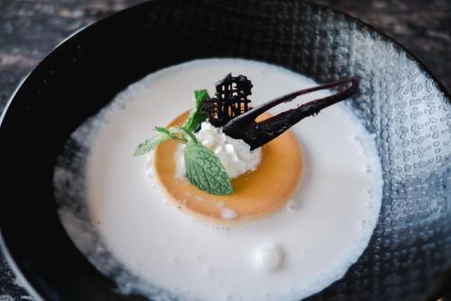 a plate of food with a dessert on it at Champaca Luxury Villas Ubud in Ubud