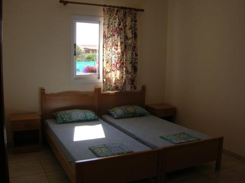 Postel nebo postele na pokoji v ubytování Marios Apartments