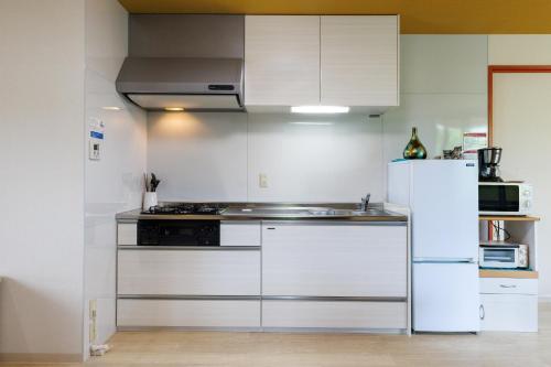 Η κουζίνα ή μικρή κουζίνα στο Jin Jin House