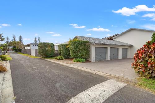 an empty street in a house with a driveway at At the Beach - Lennox Head in Lennox Head