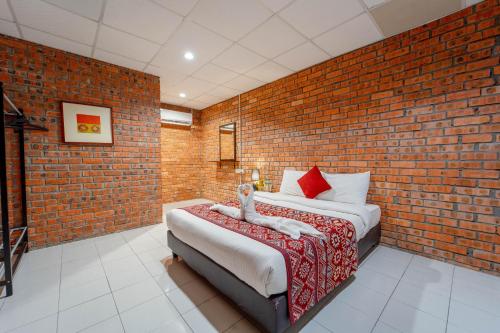 Postel nebo postele na pokoji v ubytování SANDY GARDEN RESORT LANGKAWI