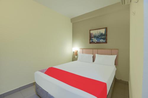 Ένα ή περισσότερα κρεβάτια σε δωμάτιο στο Hotel O Cozy Fox Hotel