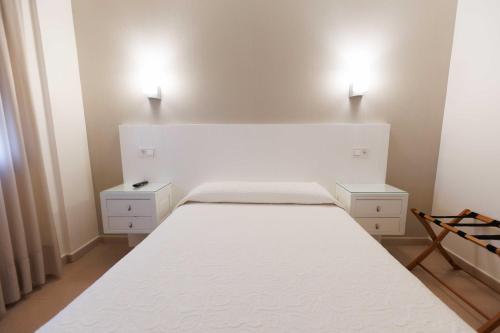 Letto o letti in una camera di Hotel O Cruceiro