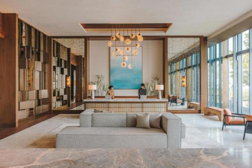 a living room with a couch and a table at Fairmont Tokyo in Tokyo