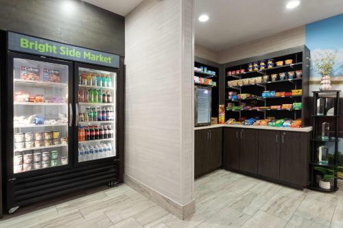 a grocery store with a refrigerator and shelves of food at La Quinta by Wyndham Columbus - Edinburgh in Columbus