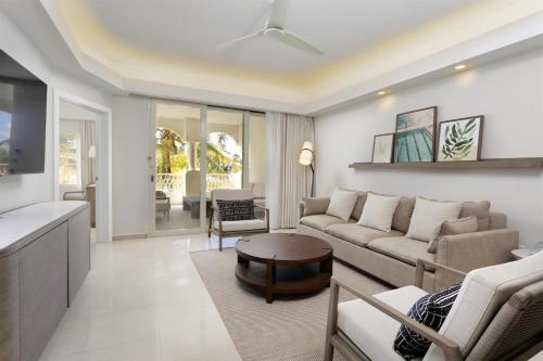 a living room with a couch and a table at Hyatt Regency Grand Reserve Puerto Rico in Rio Grande