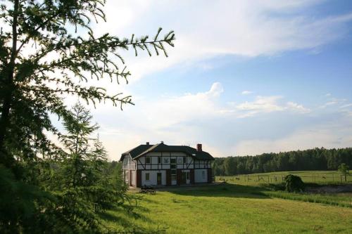 a house in the middle of a field at More Guesthouse in More