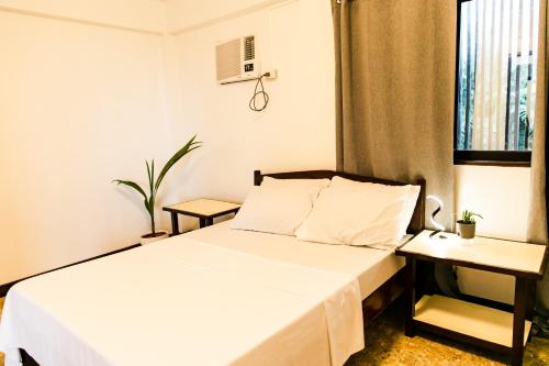 Postel nebo postele na pokoji v ubytování Apnea House Siargao