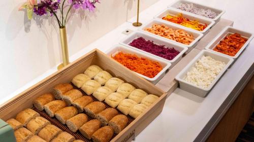 a buffet with several trays of food on a table at Motosu Phoenix Hotel in Fujikawaguchiko