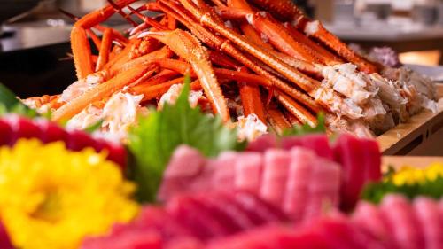 a pile of carrots and other vegetables on a table at Motosu Phoenix Hotel in Fujikawaguchiko