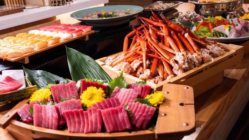 a buffet with many different types of food on display at Motosu Phoenix Hotel in Fujikawaguchiko