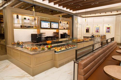 a restaurant with a buffet line with food at The Royal at Atlantis in Nassau
