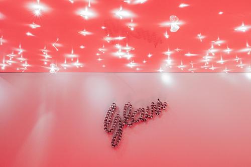 a red wall with a heart made out of butterflies at Surprise love, Mariage, fiançailles & Netflix & Park in Dijon