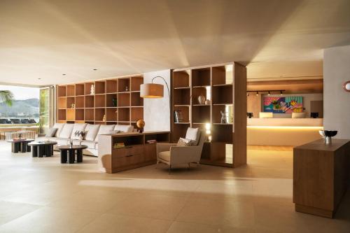 a living room with a couch and a table at INNSiDE by Meliá Alicante Porta Maris in Alicante