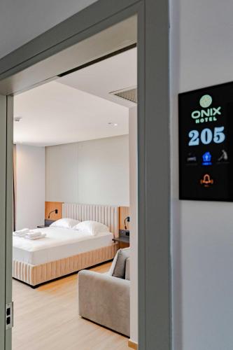 Ένα ή περισσότερα κρεβάτια σε δωμάτιο στο Hotel Boutique Onix