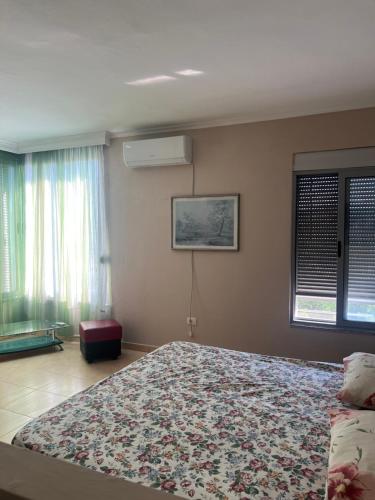 a bedroom with a large bed in a room at Lena's Guesthouse in Qerret
