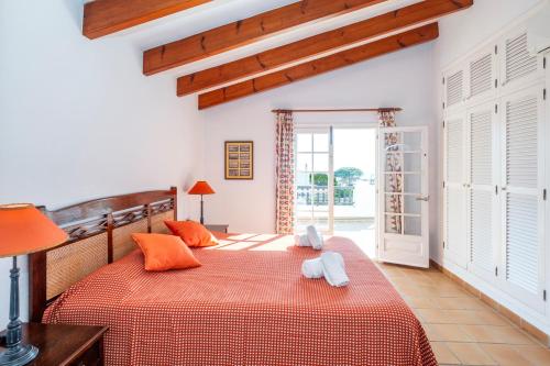 Ένα ή περισσότερα κρεβάτια σε δωμάτιο στο Villa Binigo