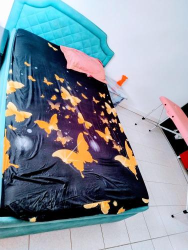 a kite with butterflies on it sitting on a floor at Massage studio-spa in Ginsheim-Gustavsburg