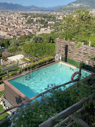 a swimming pool with a view of a city at Relais Manfredi in Castellammare di Stabia