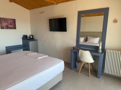 Postel nebo postele na pokoji v ubytování Leonidas Resort