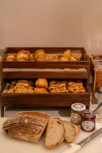 a bunch of loaves of bread on a table at Craig Manor in Bowness-on-Windermere