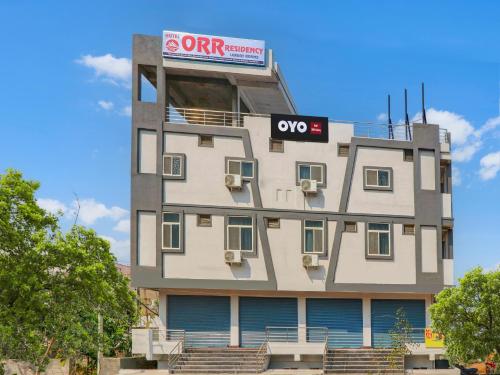 a building with a sign on the side of it at HOTEL O ORR RESIDENCY in Hyderabad