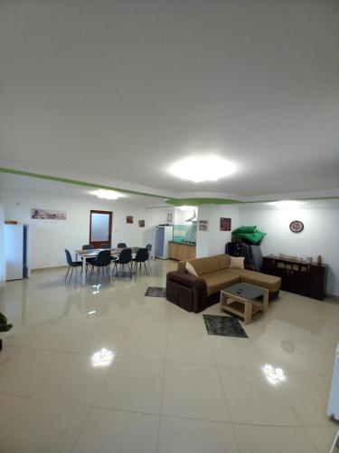 a living room with a couch and a table at Cabana BRO Clisura Dunarii in Liborajdea
