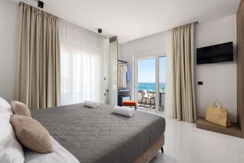 Ένα ή περισσότερα κρεβάτια σε δωμάτιο στο Elysian Luxury Residence