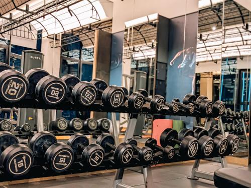 a row of dumbbells on display in a gym at Scartlez suites KLCC by Dream in Gua Sai