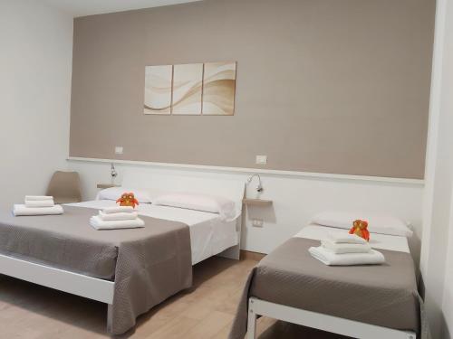 Postel nebo postele na pokoji v ubytování B&B Alle porte del centro