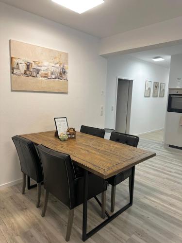 a conference room with a wooden table and chairs at Apartment with a great location in Weilheim in Weilheim in Oberbayern