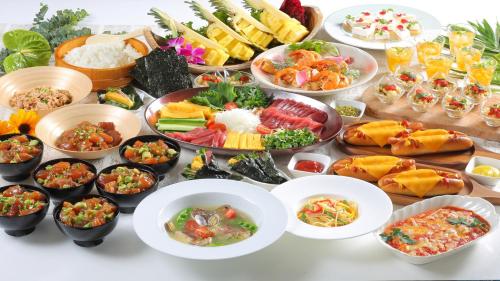 a table topped with lots of different types of food at HOTEL MYSTAYS PREMIER Narita in Narita