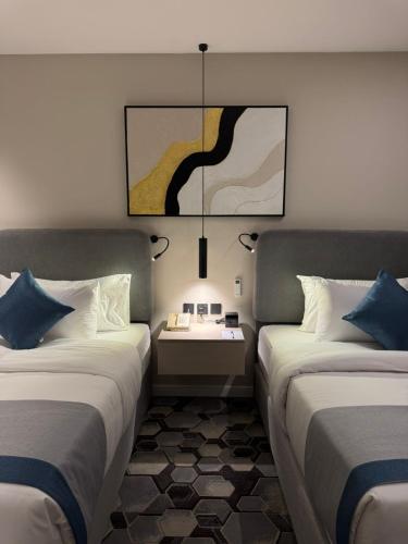 Katil atau katil-katil dalam bilik di Continent Al Waha Hotel Riyad