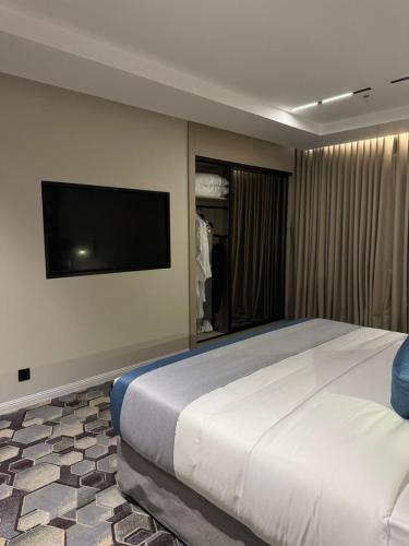 Katil atau katil-katil dalam bilik di Continent Al Waha Hotel Riyad