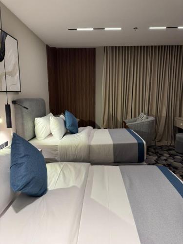 Katil atau katil-katil dalam bilik di Continent Al Waha Hotel Riyad