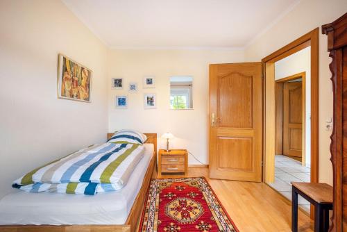 Ένα ή περισσότερα κρεβάτια σε δωμάτιο στο Ferienhaus Erlengrund A