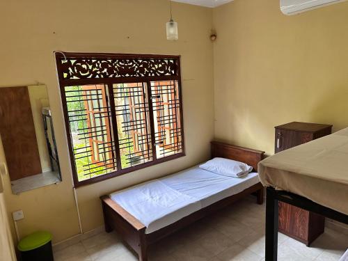 Postel nebo postele na pokoji v ubytování Ceylon Chill Bunks